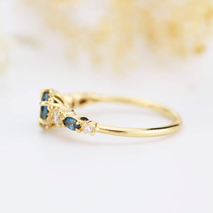 Cluster engagement ring round London blue topaz with marquise stone on the side - NOOI JEWELRY