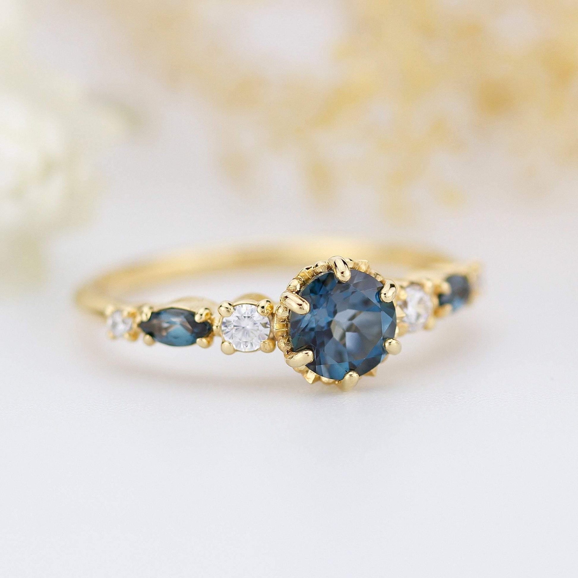 Cluster engagement ring round London blue topaz with marquise stone on the side - NOOI JEWELRY