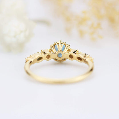 Cluster engagement ring round London blue topaz with marquise stone on the side - NOOI JEWELRY