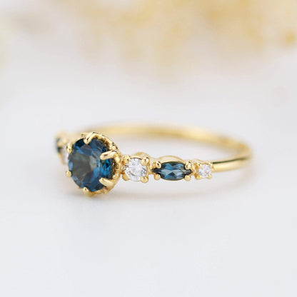 Cluster engagement ring round London blue topaz with marquise stone on the side - NOOI JEWELRY