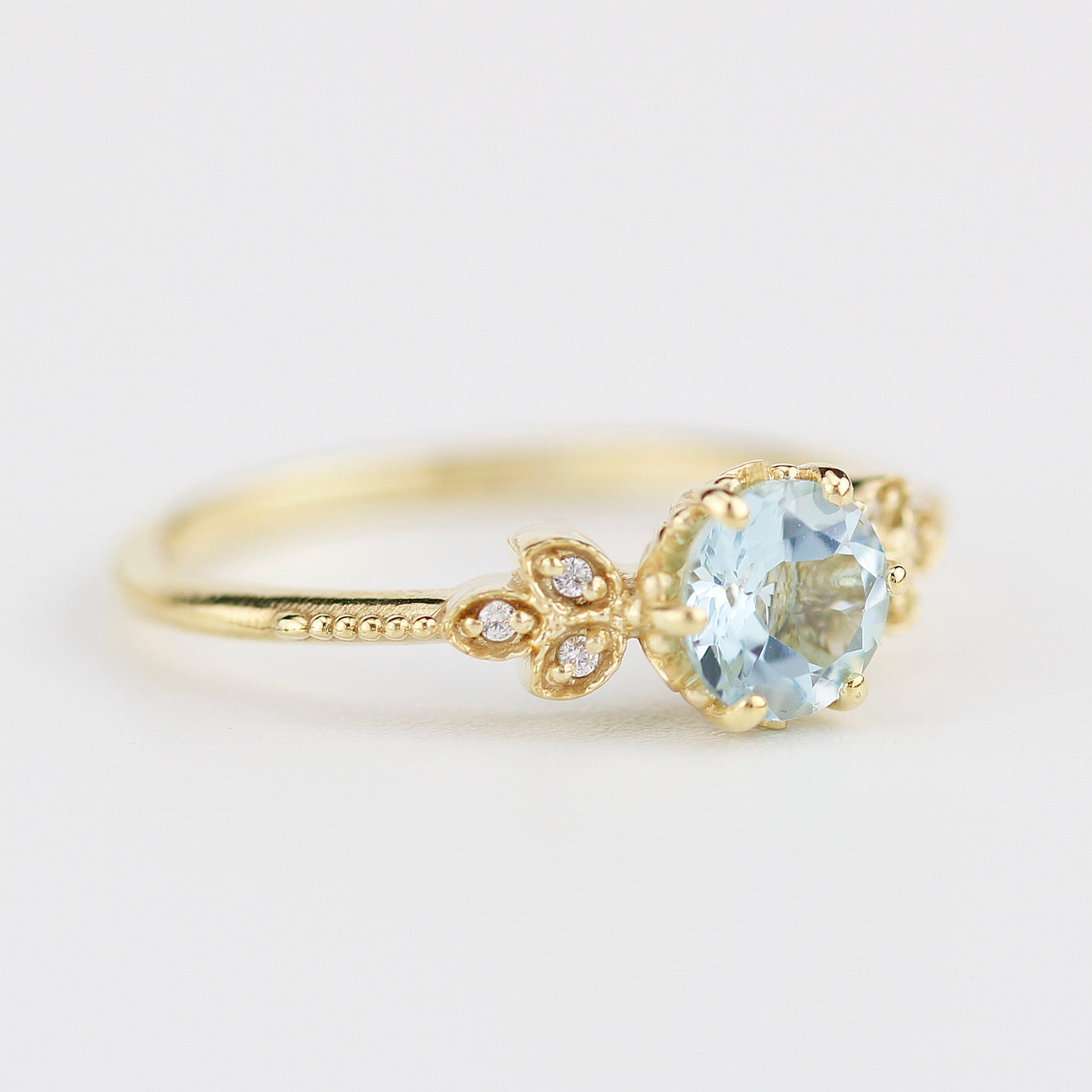 Sky blue topaz engagement ring vintage, marquise diamond setting on the side - NOOI JEWELRY